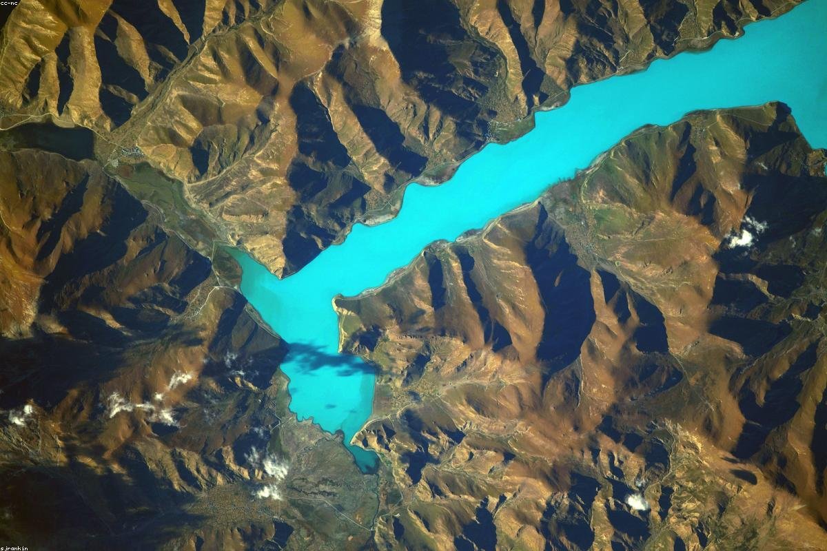 The deep blue lake of Namtso reflects the snow-capped mountains