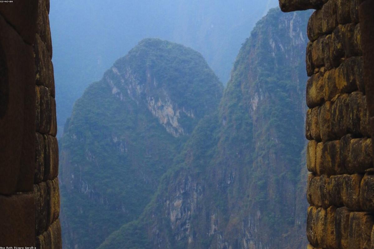 The Machu Picchu Inca site in Peru sits on a misty ridge