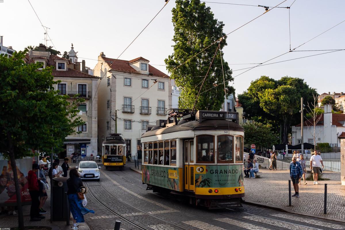 The yellow tram in Lisbon, Portugal, and the colorful old town